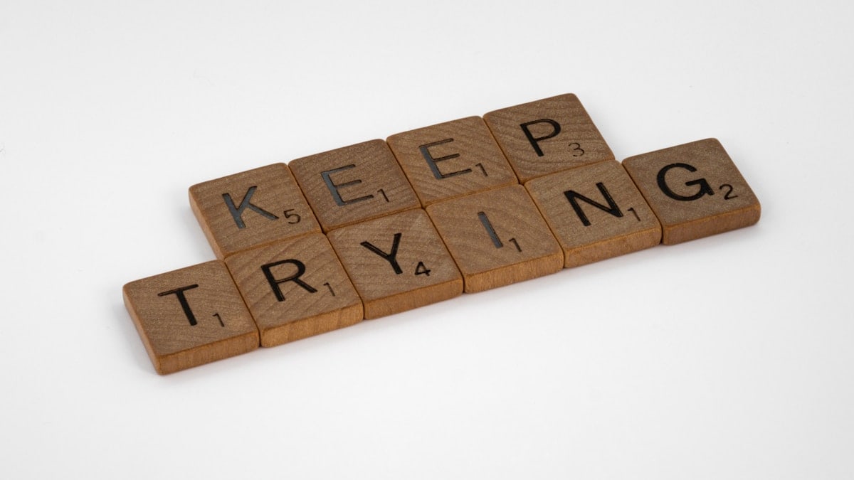 scrabble, scrabble pieces, lettering, letters, wood, scrabble tiles, white background, words, quote, letters, type, typography, design, layout, focus, bokeh, blur, photography, images, image, keep trying, do the work, work, put in the hours, laziness, procrastination, nocrastination, do it, just do it, keep going, don't stop, persistence, grind, one step at a time, one foot after the other, pressing on, press on,